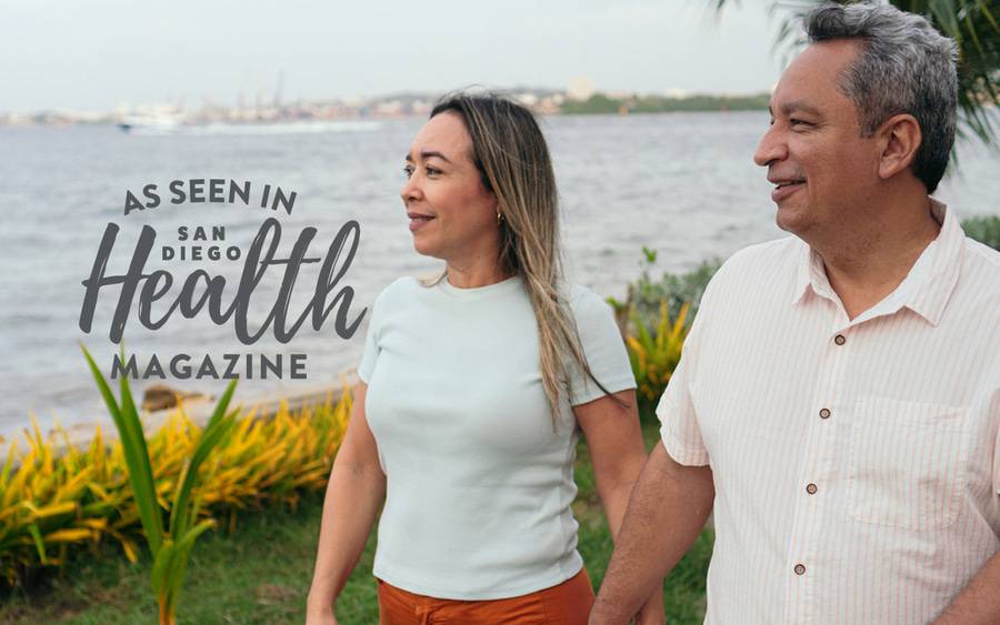 An older couple enjoy a stroll by the water with less back pain thanks to a new minimally invasive procedure. SD Health Branded