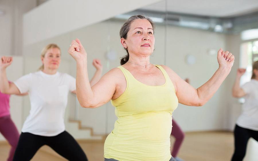 Women are taking part in an exercise class to improve balance and gait.