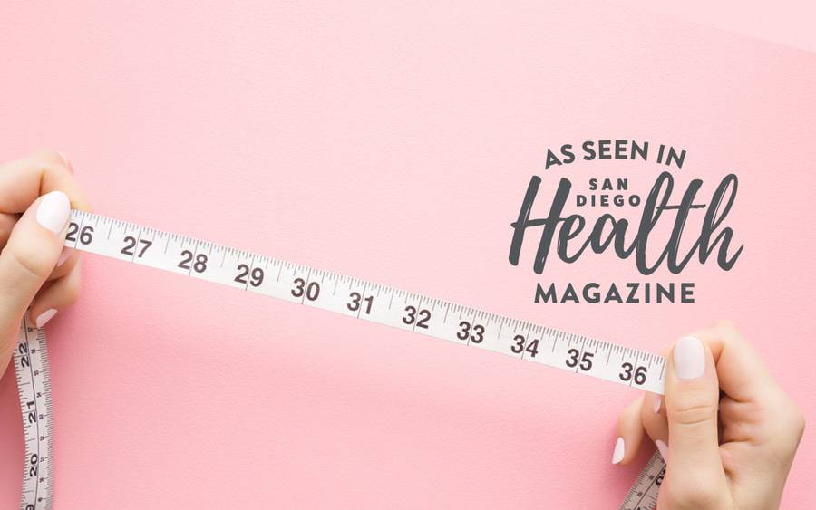 A person's hands show numbers on a tape measure - SD Health Magazine