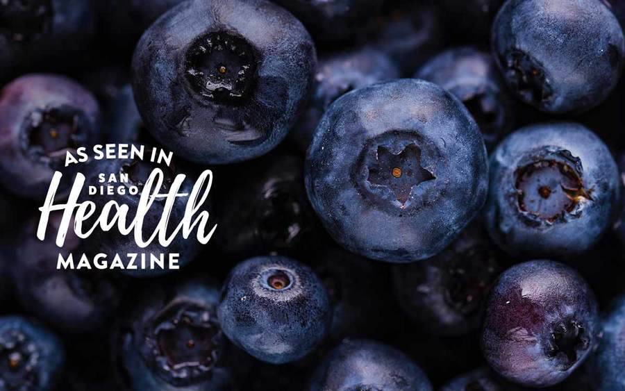 A group of fresh blueberries represents the types of superfoods you can plant in your garden.