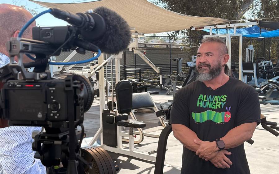 San Diego bodybuilder James Kusuda being interviewed at The Gym where he trains.