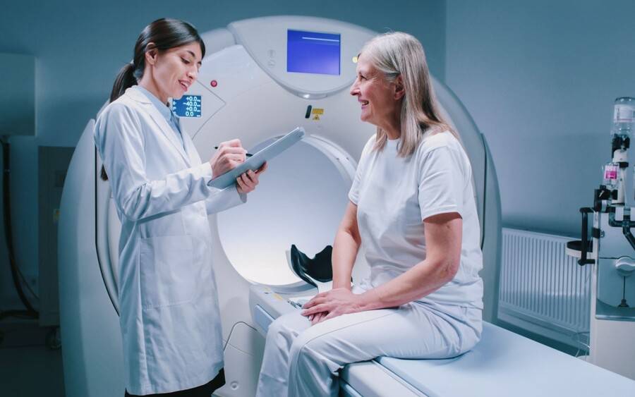 A patient gets ready for a CT scan.