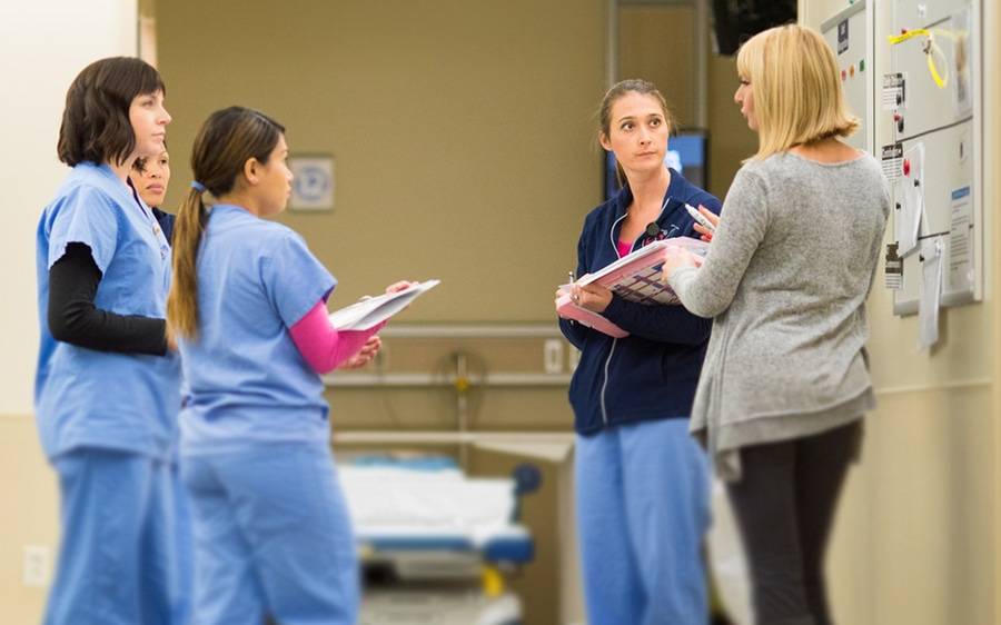 Hospital staff gather to plan their rounds, as the CEO blog details why their efforts offer the best gift of all: Life.