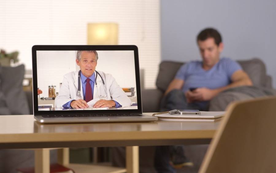 Diabetes patient texting and communicating with physician via webcam.