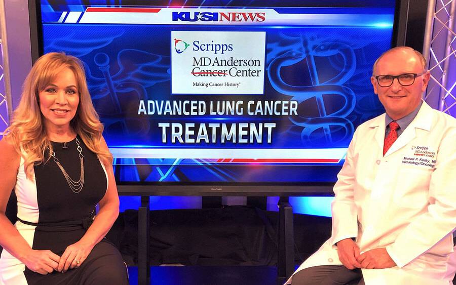 KUSI-TV anchor Ginger Jeffries sits with Dr. Michael P. Kosty of  Scripps MD Anderson Cancer Center in a TV studio.
