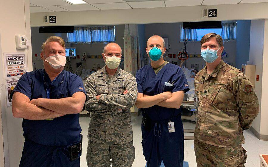 Scripps trauma surgeon Dr. Matthew Martin stands with a medical team at  Jacobi Medical Center during COVID-19. 