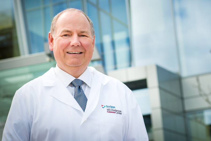 Thomas Buchholz, MD, stands in front of the Scripps MD Anderson Center in San Diego.