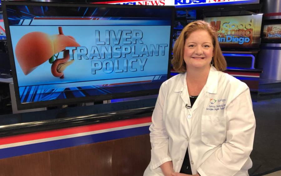 A Scripps doctor prepares to discuss a new liver transplant policy on the news.