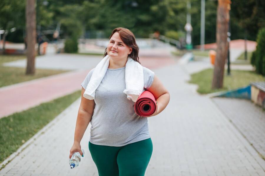 GLP-1 weight-loss medication user getting ready to workout as recommended.
