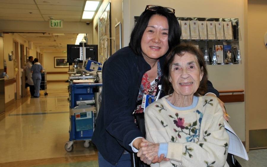 Scripps Encinitas nurse, Grace Cao, embraces a Scripps patient, and ultimately netted a CARE award by CBS Radio.