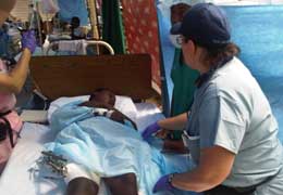 Scripps nurse caring for Haiti patient. 