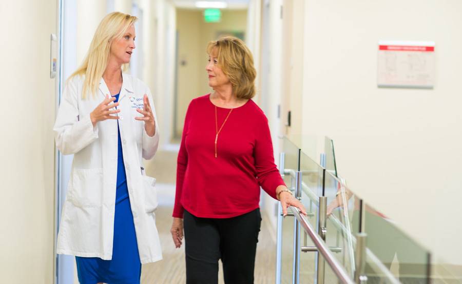 Older woman with heart issues discusses care plan with her cardiologist at Scripps.