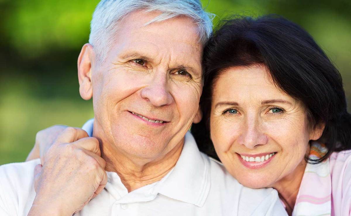 A smiling mature couple represents the full life that can be led after esophageal cancer treatment.