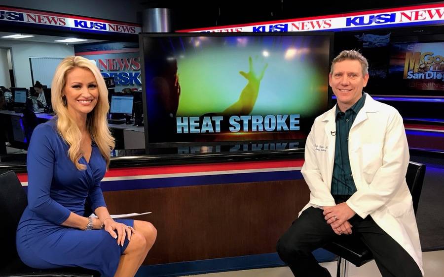 Dr. Mark Shalauta and KUSI anchor Lauren Phinney at KUSI studio discussing heat stroke.