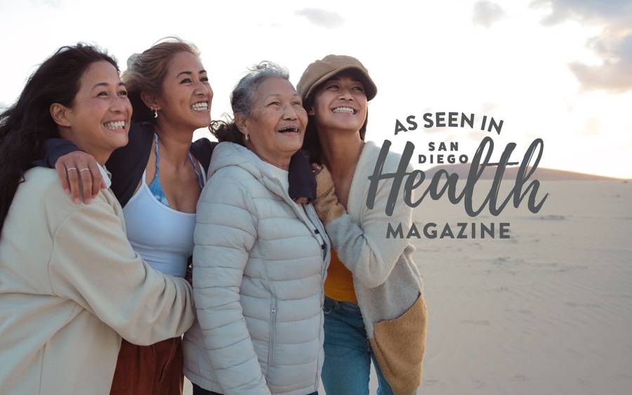 Three generations of women smile as they walk through a desert landscape. SD Health Magazine