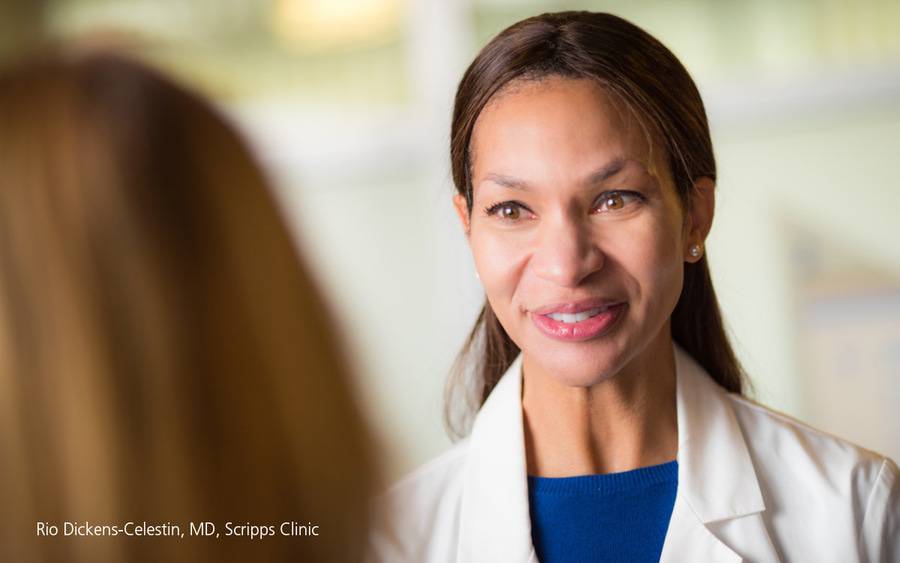Dr. Rio Dickens-Celestin smiling at a patient.