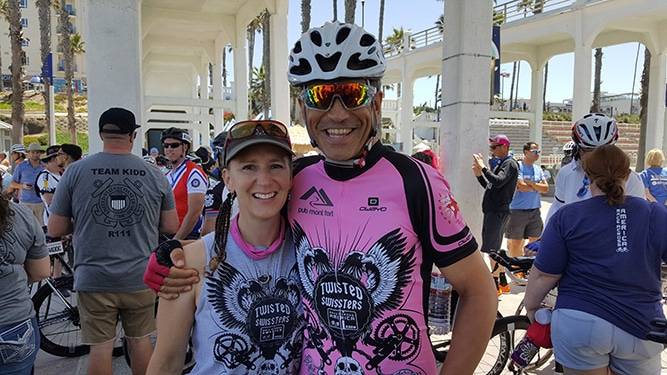 Swiss skiing champion, Philippe May, smiles in a photo with his wife prior to a Race Across the West ultra-cycling race.