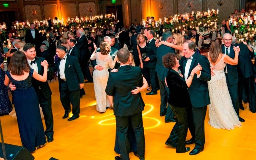 Attendees of the Annual Candlelight Ball gather on the dancefloor as Scripps rings in the holiday season.