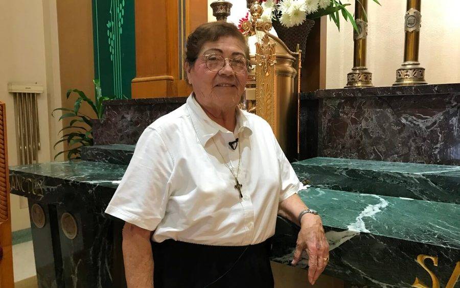 Sister Margaret Castro stands near the altar at St. Rita's Church in San Diego following a successful knee surgery.