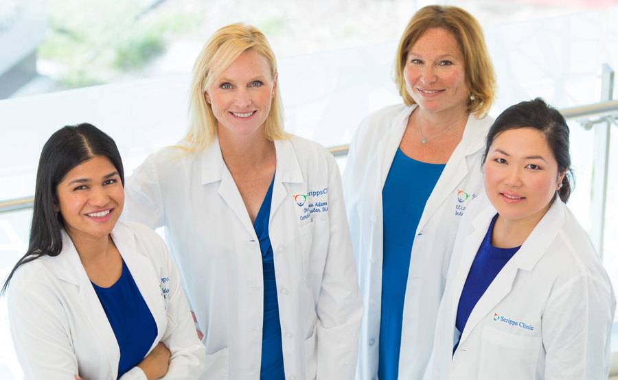 Four Scripps female cardiologists smile and stand proudly together after the Scripps Women's Heart center opened.