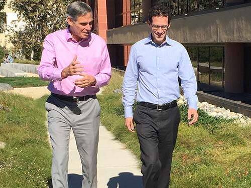 DePodesta and Dr. Topol walking on a sunny day.
