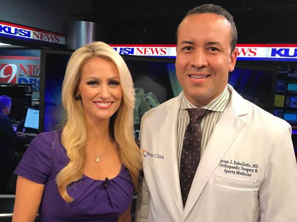 KUSI anchor Lauren Phinney and Scripps Clinic Dr. Brian Rebolledo at KUSI studio after interview on sports-related orthopedic injuries.