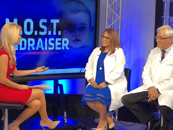 Scripps Mercy Outreach Surgical Team volunteers Dr. Kent Diveley and nurse Susana Verdugo-Ramos discuss the upcoming Mariachi Festival fundraiser with KUSI host Lauren Phinney.