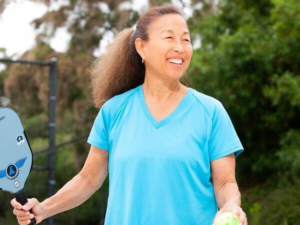 Nancy Butsumyo smiles on the pickleball court. A prediabetes diagnosis was a wakeup call to make lifestyle changes to prevent type 2 diabetes, which runs in her family. 