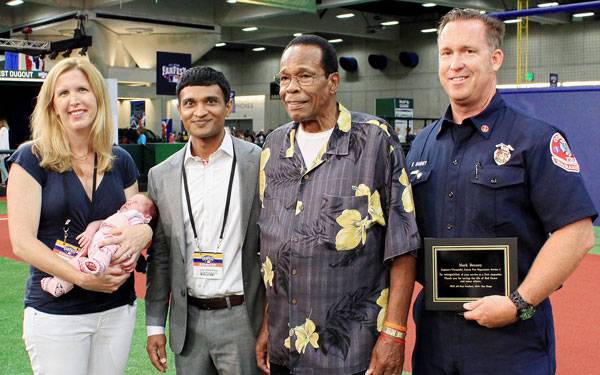 Scripps representative standing with MLB Hall of Famer Rob Carew.