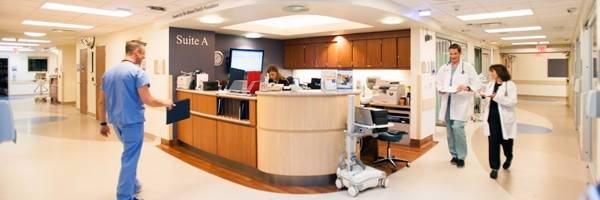Physicians walk down the hallway of a Scripps hospital unit.