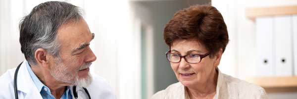 A Scripps physician discusses different types of arrhythmia with a patient.