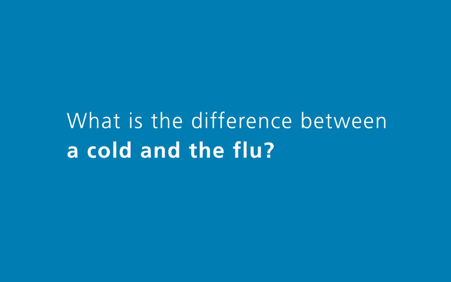 A bedridden woman with the flu or a cold smiles when she is visited by a family member.