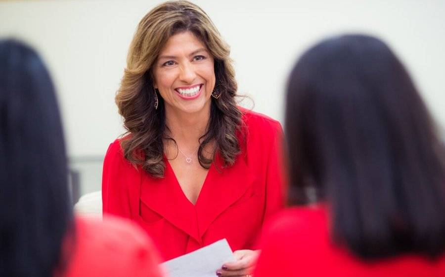 B. Verde, a two-time heart attack survivor who was treated at Scripps, smiles at a women's heart support group meeting.