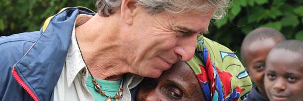 Scripps heart patient Bill Toone embraces a friend in Africa.