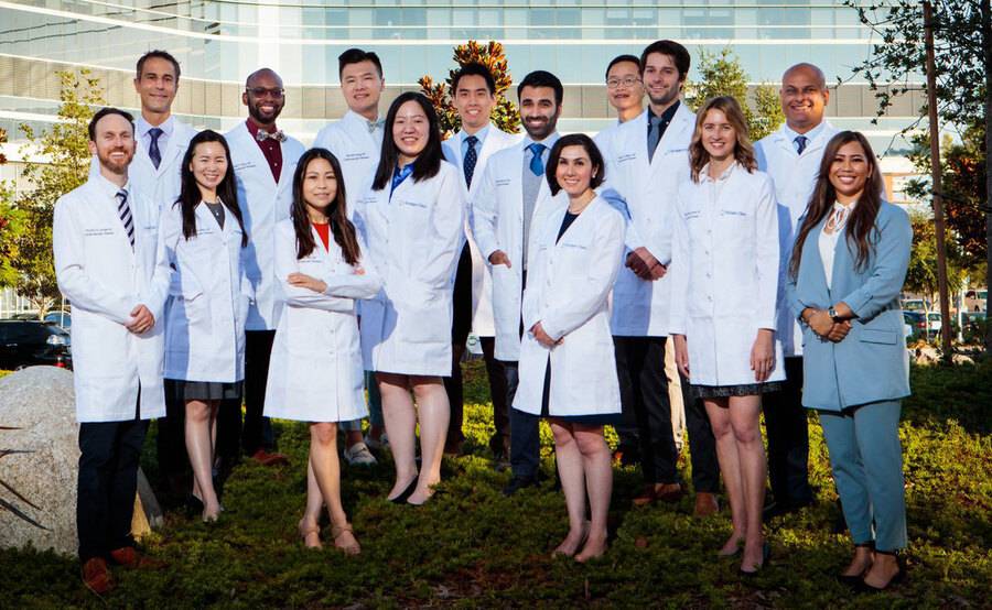 Members of the Scripps Cardiovascular Disease Fellowship Program gather outdoors for a photo.