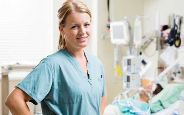 Nurse giving care to sick patients in teh hospital