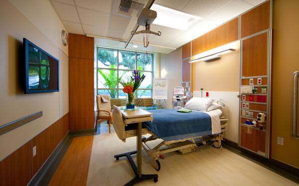 Private patient rooms feature large windows to showcase artful landscapes and plenty of space for family members.