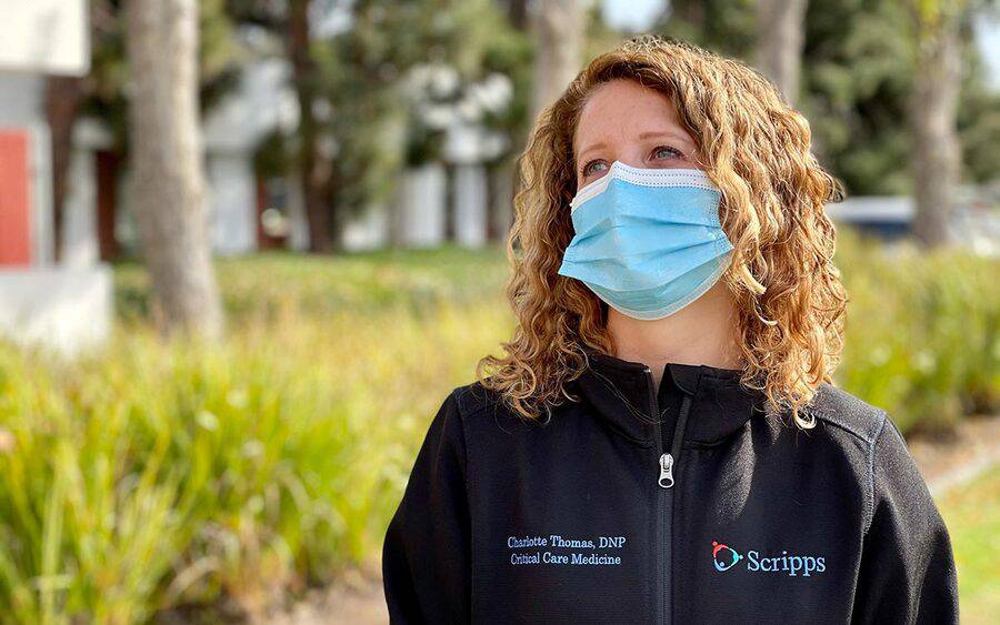 Charlotte Thomas, a Scripps nurse practitioner who cares for COVID ICU patients, stands outside of Scripps Mercy Hospital Chula Vista.
