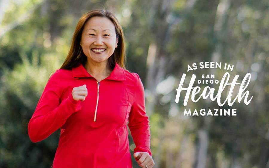 Personal trainer Christine Burke runs in a San Diego park after hip replacement surgery at Scripps relieves her chronic hip pain.