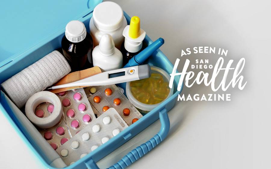 A medicine box is filled with the essentials including cold and flu medicines, thermometer and bandages. SD Health Magazine