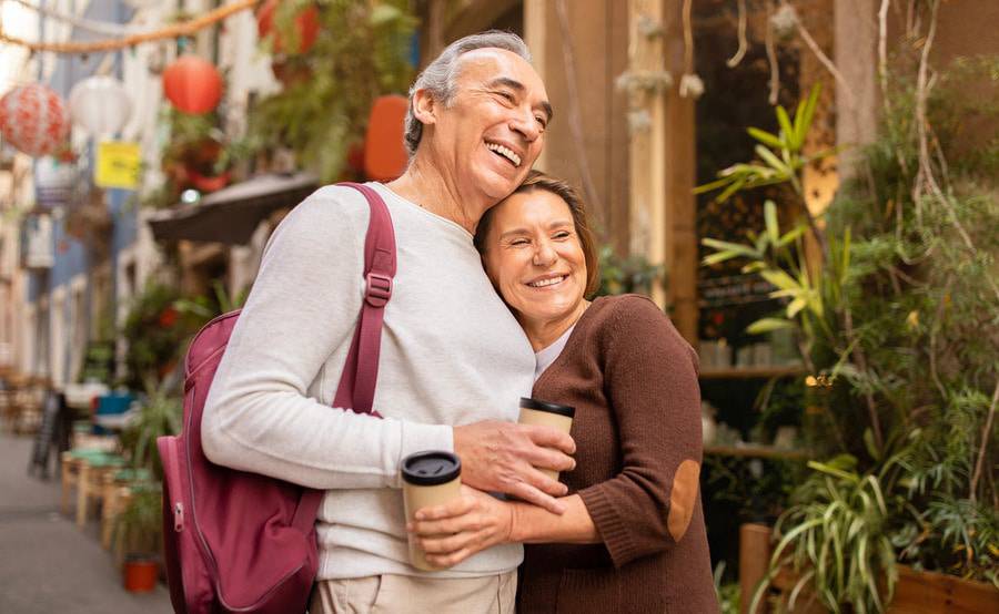 A happy mature couple on vacation represents the successful treatment of disorders of the colon.
