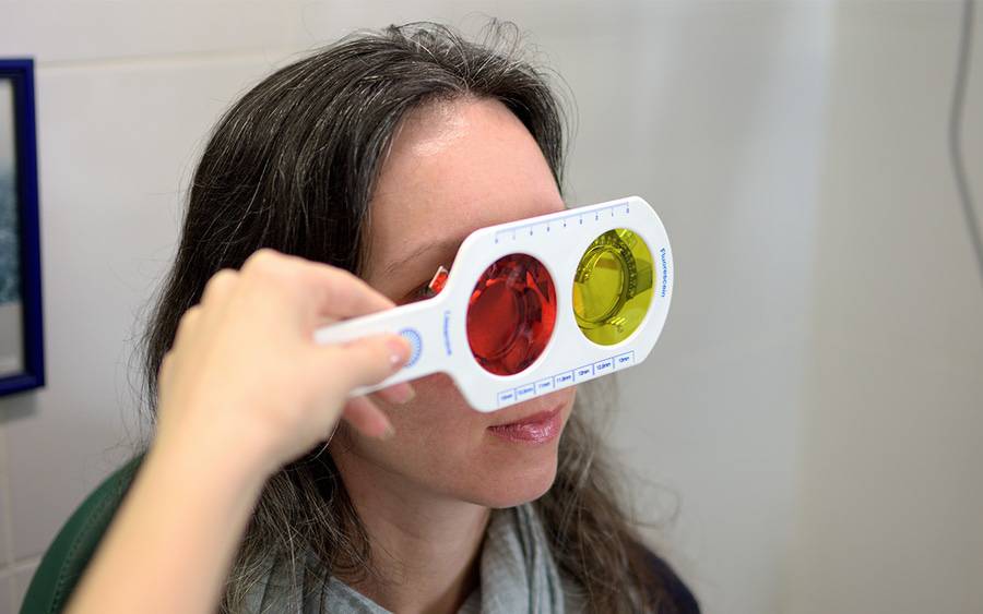 A woman undergoes a color vision test to see if she has color vision deficiency or color blindness.