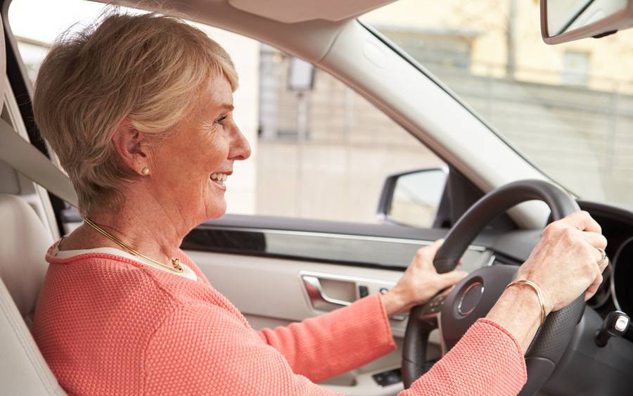 Senior driver behind the wheel safely after passing driver safety evaluation.