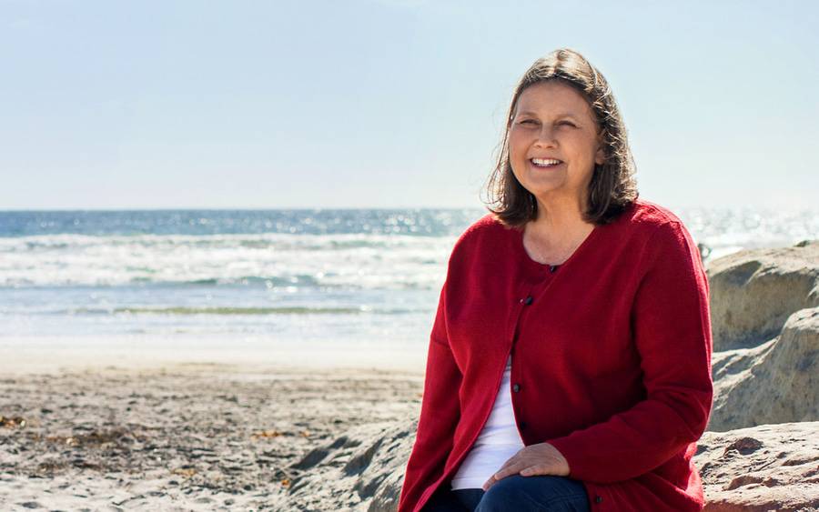 Female heart patient, Kim Trauth, enjoys cool coastline weather and is grateful for the expert care she received at Scripps.