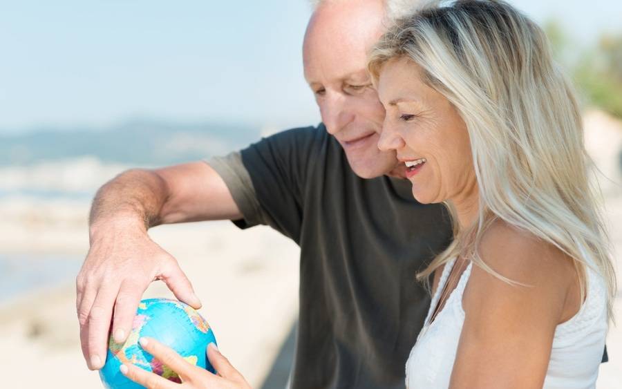 Older couple plan their next long-distance vacation travel.
