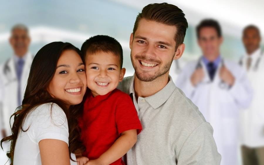 A young, mixed culture family celebrate the Health Net and Scripps partnership for Covered California. 