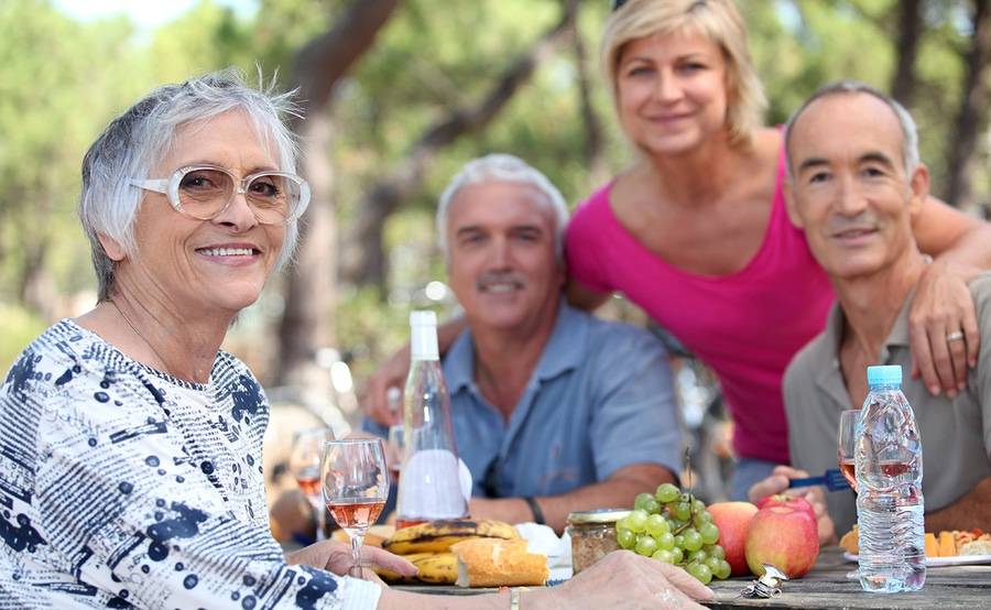 Mature woman at picnic with others