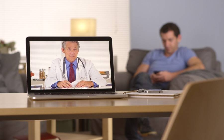 Diabetes patient texting and communicating with physician via webcam.