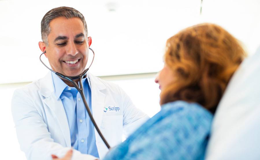 Dr. Ardeshir Dabestani examining a female patient in the new medical surgery patient rooms in the Lusardi Tower.
