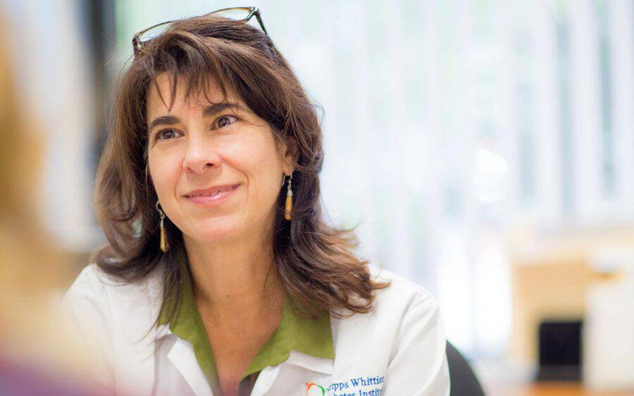 Dr. Athena Philis-Tsimikas, Endocrinologist, Scripps Clinic looking and a patient with compassion.
